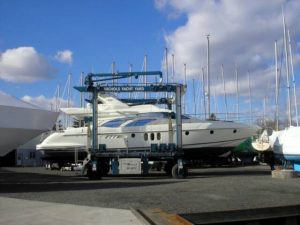 boat being moved via travelift at nichols yacht yard
